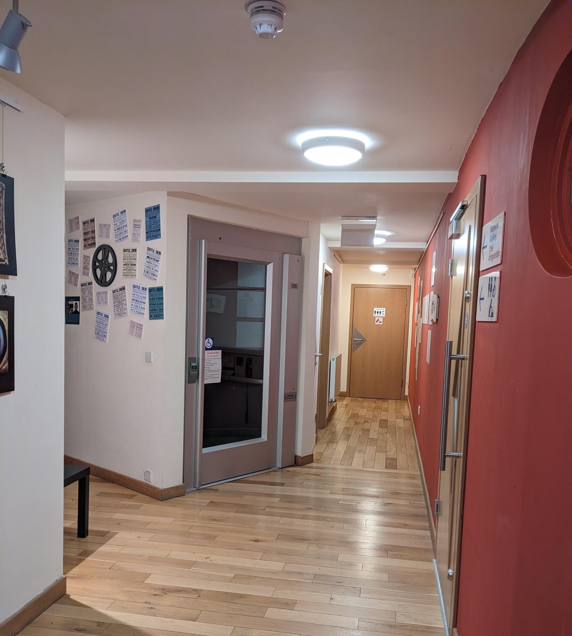 A corridor with accessible signage